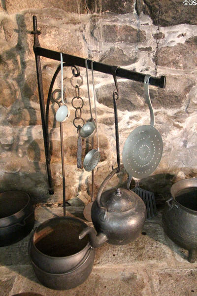 Fireplace andiron with pots at Castle Fraser. Aberdeenshire, Scotland.