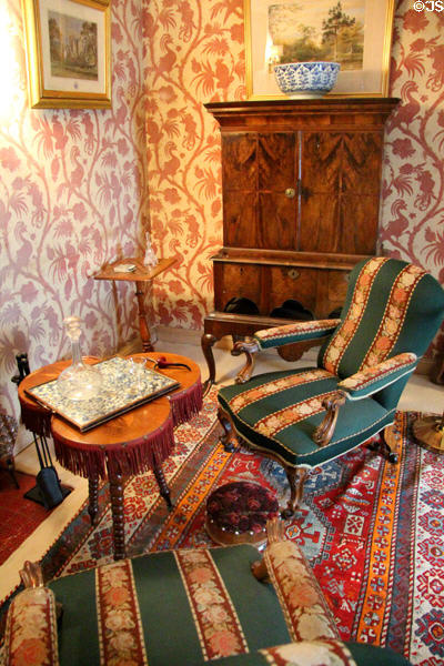 Peacock parlour with tripod / trefoil table with arm chairs at Castle Fraser. Aberdeenshire, Scotland.