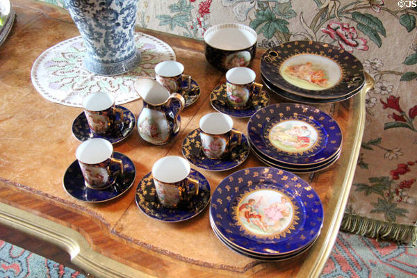 Individually painted cups, saucers & cake plates in morning room at Fyvie Castle. Turriff, Scotland.