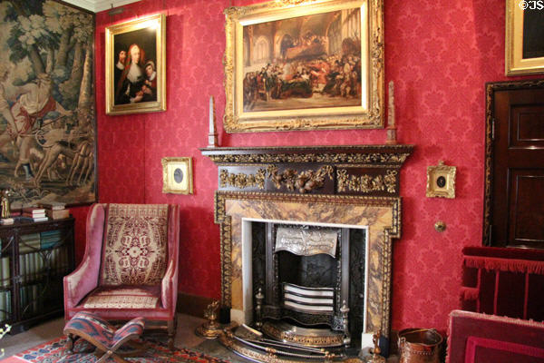 Library fireplace with Trial of Charles I painting above at Fyvie Castle. Turriff, Scotland.