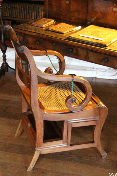 Chair which unfolds into ladder beside writing desk in library at Brodie Castle. Brodie, Scotland.
