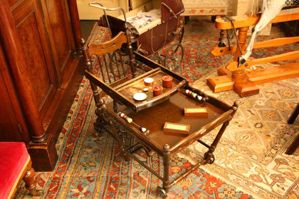 Child's chair with attached tables at Brodie Castle. Brodie, Scotland.