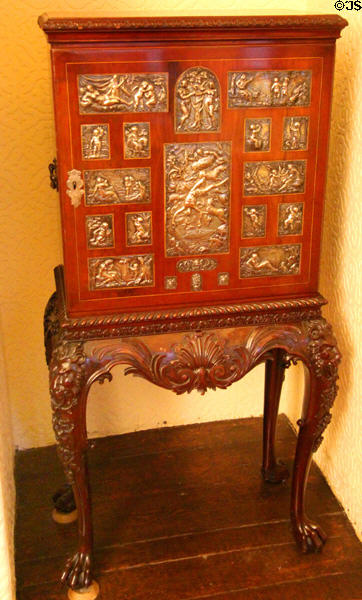 Cabinet embossed with metal scenes at Brodie Castle. Brodie, Scotland.