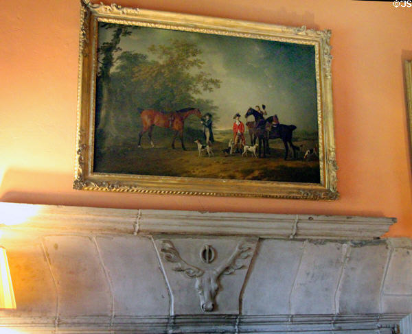 Gentlemen with horses & hunting dogs painting over drawing room fireplace mantle at Cawdor Castle. Cawdor, Scotland.