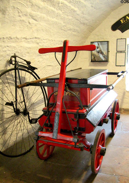 Antique fire pumper engine at Cawdor Castle. Cawdor, Scotland.