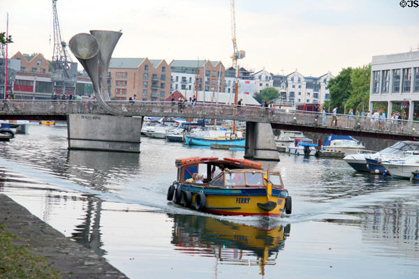 Bristol Ferry which provides transportation to various places on Floating Harbour with Pero's bridge in the background. Bristol, England.