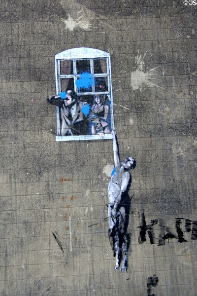 "Well Hung Lover" wall painting (2006) by Banksy. Bristol, England.