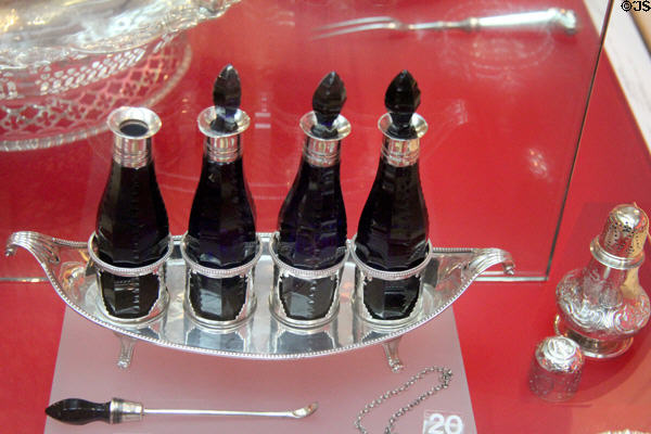 Sauce cruet (1786-7) with bottles holding soy & anchovy sauces, cayenne & ketchup by Robert Hennell, London at Bristol Museum & Art Gallery. Bristol, England.