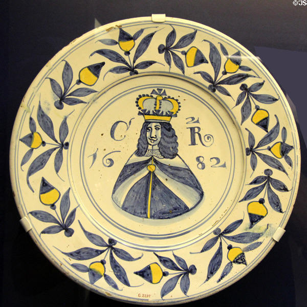 Ceramic charger (1682) with portrait & initials of King Charles II, made in Brislington close to Bristol, at Bristol Museum & Art Gallery. Bristol, England.