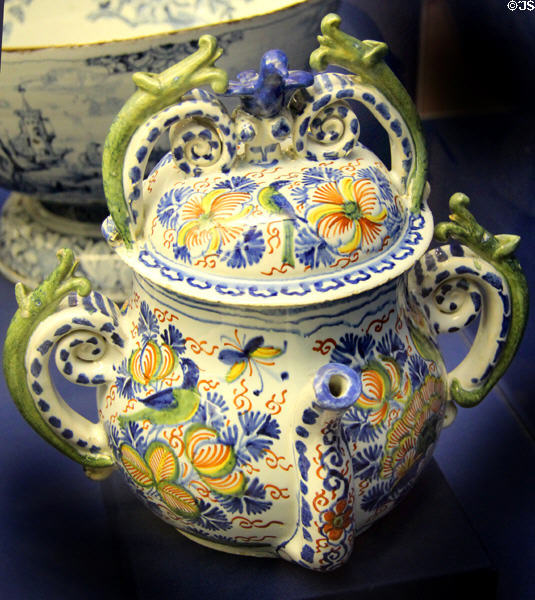 Ceramic posset pot (c1700) with handles shaped as snakes or dragons, likely made in Bristol, at Bristol Museum & Art Gallery. Bristol, England.