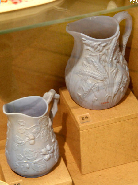 Ceramic white jugs (1850-2) with moulded relief decoration of hop flowers believed to have been made by Charles Toft at Bristol Pottery at Bristol Museum & Art Gallery. Bristol, England.