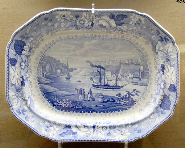 Blue & white oval serving dish (1825-35) showing Avon River scene, made by Bristol Pottery using underglaze transfer-printing process at Bristol Museum & Art Gallery. Bristol, England.