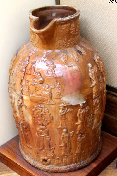 Salt-glazed brown stoneware jug (1834) decorated with images of Roman figures made by W & T Powell, Bristol at Bristol Museum & Art Gallery. Bristol, England.