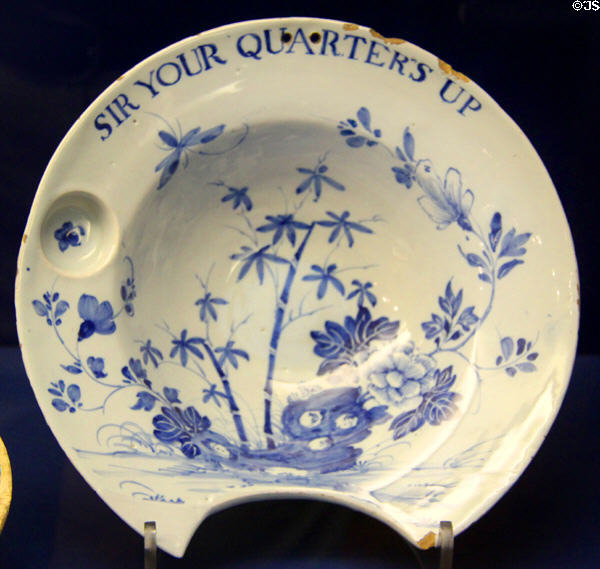 Ceramic barber's bowl (1720-40) with notice "Sir Your Quarters Up" to remind customers to pay their quarterly bill, made in Liverpool, at Bristol Museum & Art Gallery. Bristol, England.