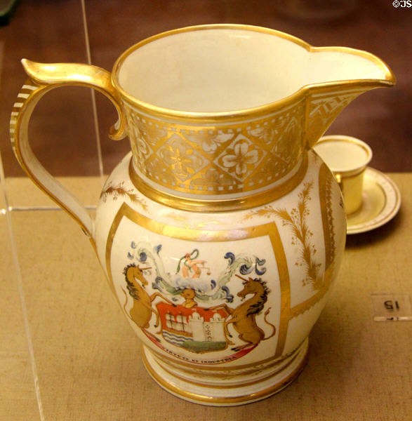 Gilded ceramic pitcher (19thC) with unicorn crest plus French phrase "VIRTUTE ET INDUSTRIA" (By Virtue & Industry) at Bristol Museum & Art Gallery. Bristol, England.