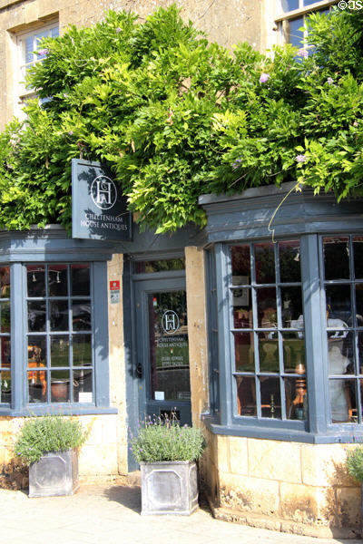 Cheltenham Antiques Shop with small paned bow windows on The Green. Broadway, England.