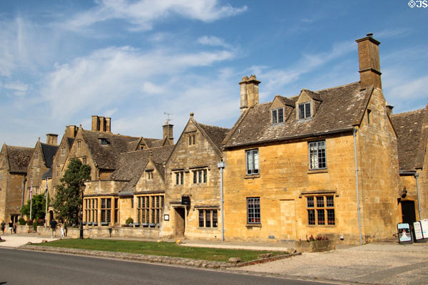 Streetscape of heritage buildings constructed in honey colored stone. Broadway, England.