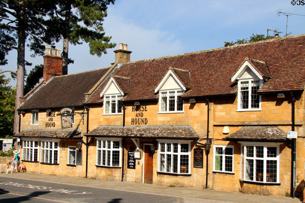 Horse & Hound restaurant on High St. situated in typical honey stone row housing. Broadway, England.