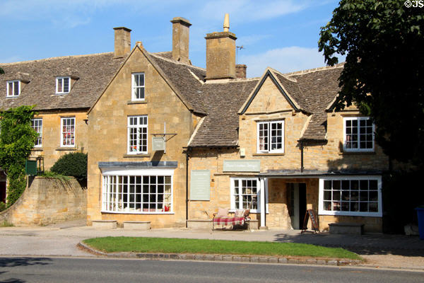 Susie Watson Designs shop displaying merchandise in bow window of Yew Tree House. Broadway, England.