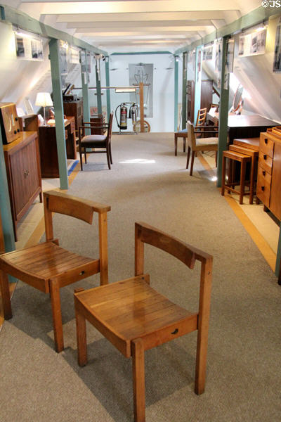 Examples of furniture designed by Sir Gordon lining hallway at Gordon Russell Design Museum. Broadway, England.