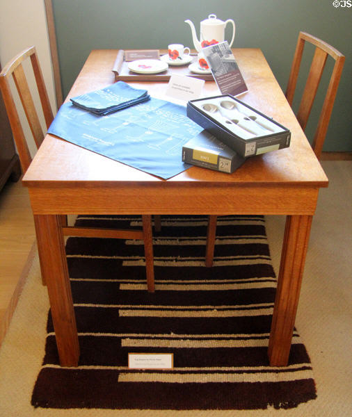 Oak table with fluted legs (1929) and two chairs designed by Sir Gordon & part of the Weston dining group at Gordon Russell Design Museum. Broadway, England.