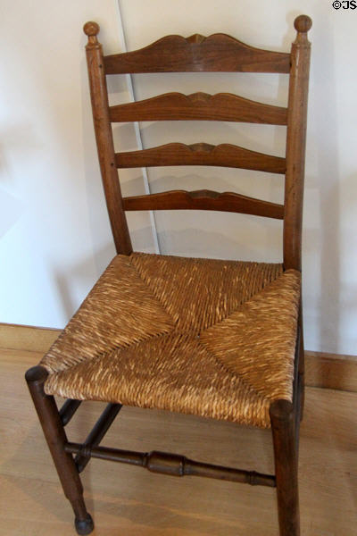 Turned single chair in laburnum wood with rush seating & shaped back rails (1928) designed by Gordon Russell at Gordon Russell Design Museum. Broadway, England.