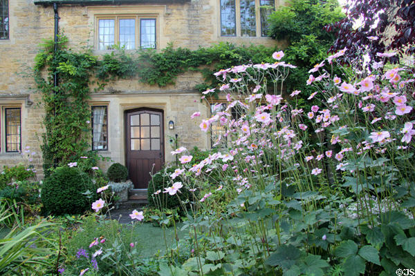 Garden in front of heritage home on the River Windrush. Bourton-on-the-Water, England.