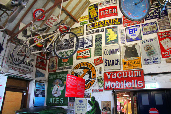 Advertising plaques often found on walls of shops, garages & the like in the earlier part of the 20thC at Cotswold's Motoring Museum. Bourton-on-the-Water, England.