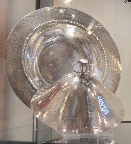 Silver-plated muffin plate & cover (c1900) notable for its pattern of delicate hammer marks by Charles Robert Ashbee at Court Barn Museum. Chipping Campden, England.