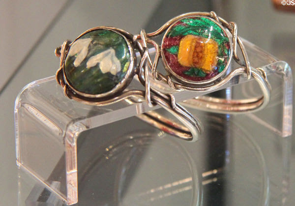 Pair of silver napkin rings (c1900) with wirework & enameling by Charles Robert Ashbee at Court Barn Museum. Chipping Campden, England.