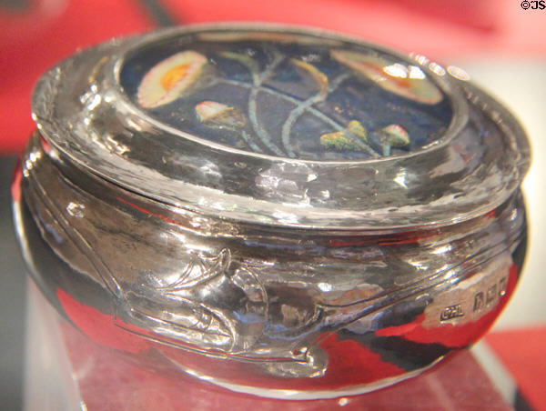 Silver box with enameled lid (1903) made by Guild of Handicraft with enameled flowers created by William Mark at Court Barn Museum. Chipping Campden, England.