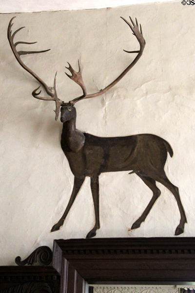 Ornamental antlers with attached deer image in Great Hall at Chastleton House. Moreton-in-Marsh, England.