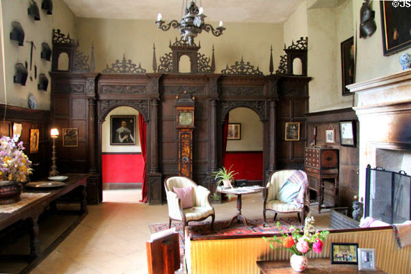 Sitting room with ornate wooden screen at Chastleton House. Moreton-in-Marsh, England.