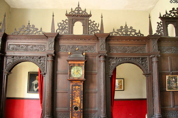 Detail of ornate wooden screen separating sitting room from hallway at Chastleton House. Moreton-in-Marsh, England.