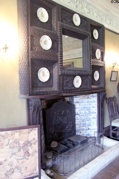 Fireplace with mantel displaying plate collection at Chastleton House. Moreton-in-Marsh, England.