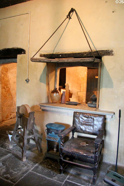 Kitchen equipment including knife sharpener, small heater & leather chair at Chastleton House. Moreton-in-Marsh, England.
