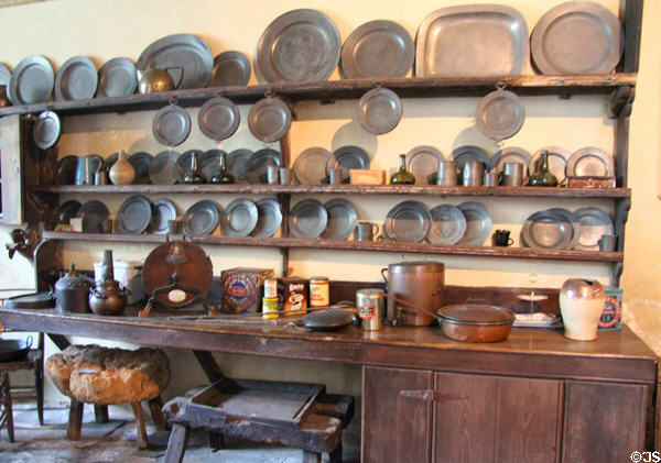 Pewter plate collection & array of antique kitchen equipment at Chastleton House. Moreton-in-Marsh, England.