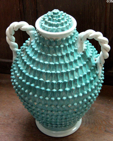 Sea green Italian urn with leaf type molded decorations at Snowshill Manor. England.
