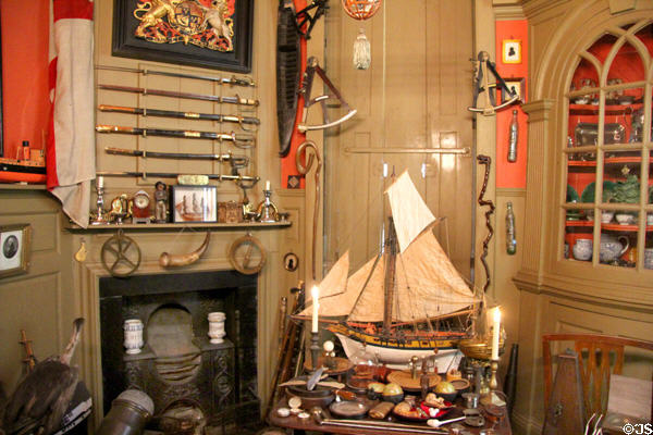 Sailing ship, sword collection & other objects at Snowshill Manor. England.