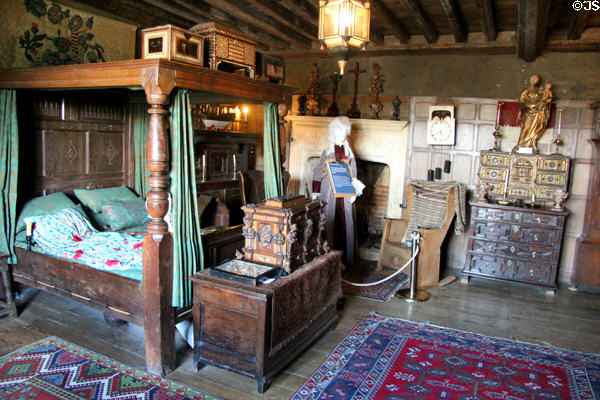 Bedroom with antique furnishings at Snowshill Manor. England.