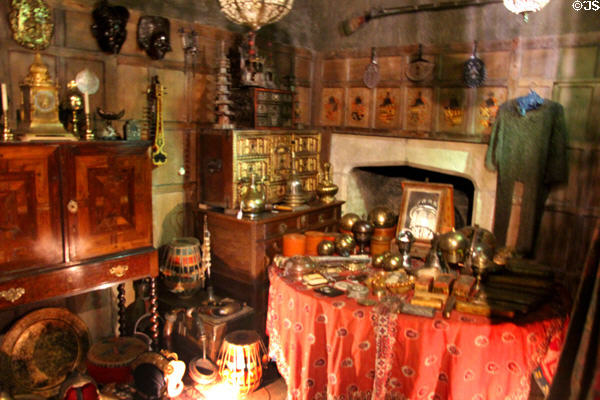 Room filled with large variety of collectibles at Snowshill Manor. England.