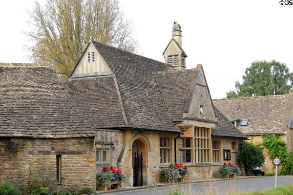 Cotswold stone building with angular slate roof. Lower Slaughter, England.