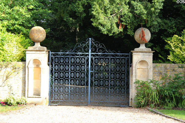 Ornate wrought iron fence at entrance to property. Stanton, England.