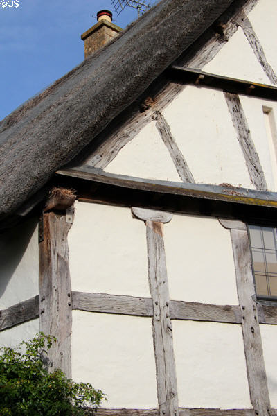 Detail of half-timbered building with thatched roof. Stanton, England.