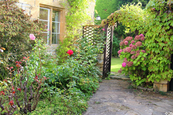 Front garden with flowers and shrubs. Stanton, England.