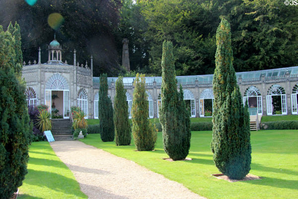 Walkway to Orangery lined by Irish yews at Sezincote. Moreton-in-Marsh, England.