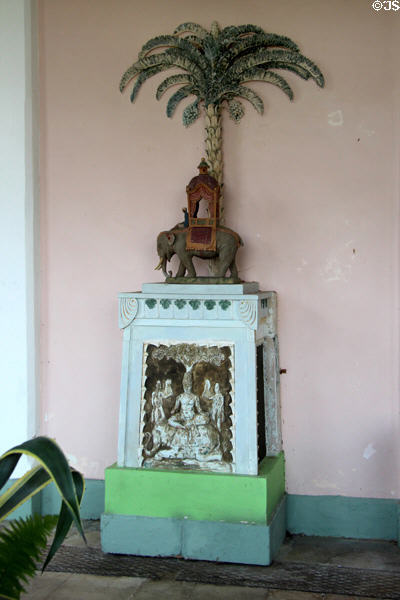Indian artwork mounted on pedestal in Orangery at Sezincote. Moreton-in-Marsh, England.