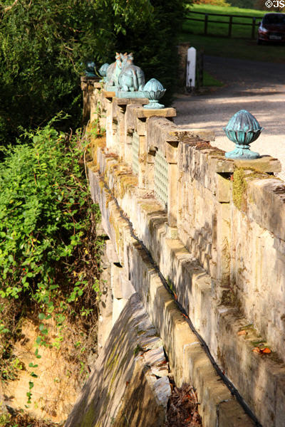 Decorated railing across footbridge at Sezincote. Moreton-in-Marsh, England.