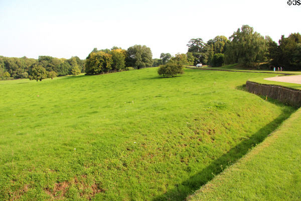 Green lawns with ha-ha barrier on walk towards Sezincote Palace. Moreton-in-Marsh, England.