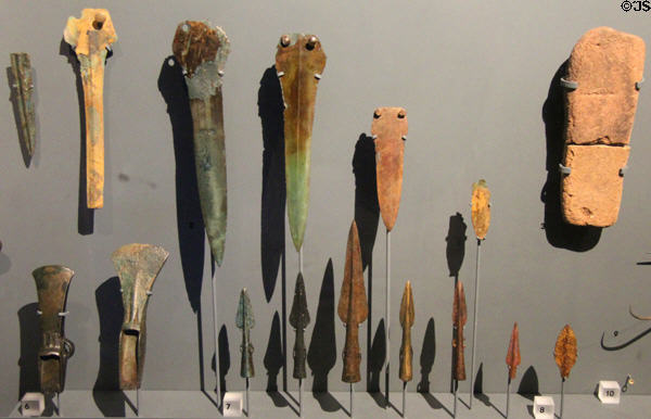 Bronze Age metalwork, made from mixture of copper & tin, consisting of spearheads & arrowhead at Corinium Museum. Cirencester, England.